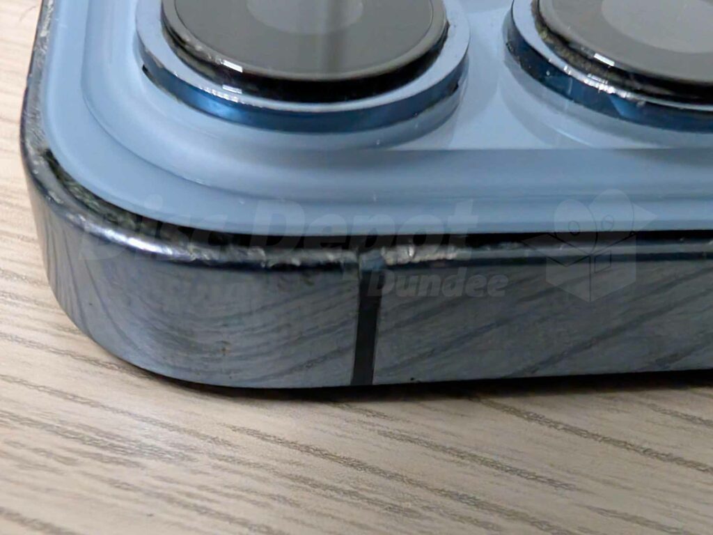 iPhone 13 Pro showing faulty back glass replacement with bulging lens