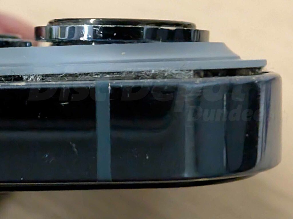 iPhone 13 Pro showing faulty back glass replacement with bulging lens