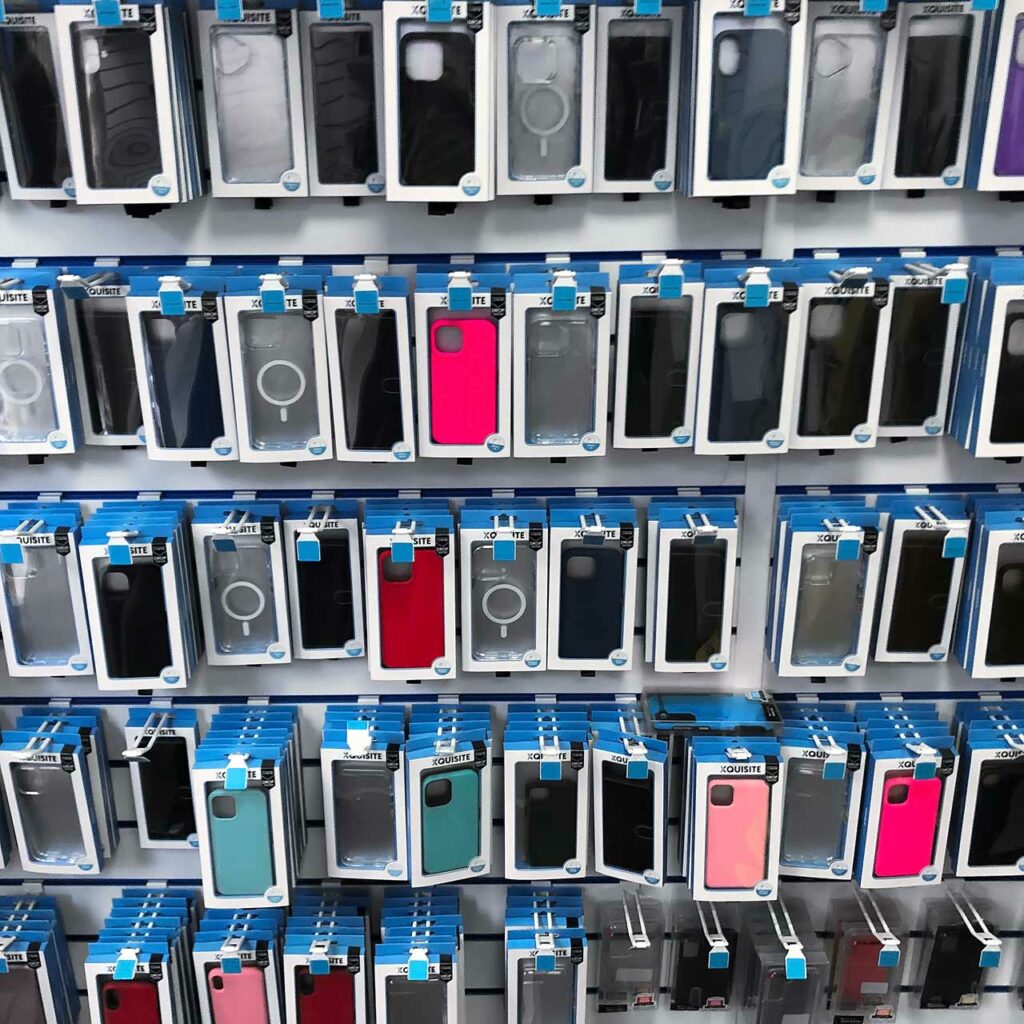 Multiple racks displaying phone cases for the Apple iPhone 16, iPhone 15, iPhone 14 and other models