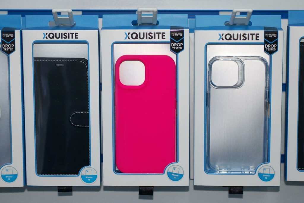 Three racks holding different Xquisite phone cases for the Apple iPhone 15